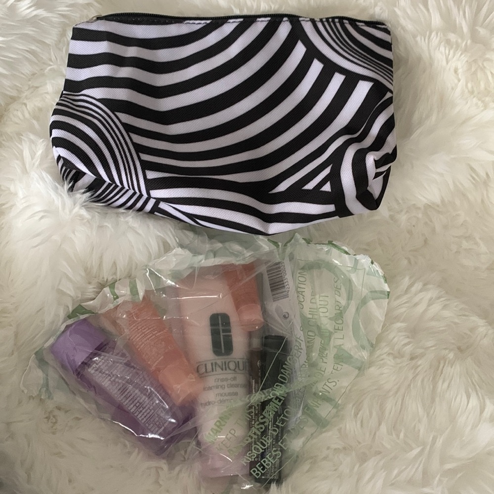 New clinique cosmetic travel pouch with makeup and cleanser lip mascara eyeliner